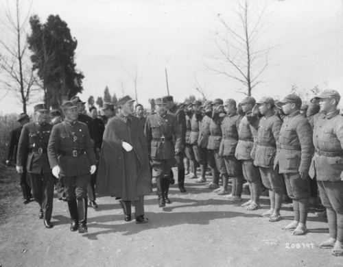 Chiang Kai-shek reviews troops of the Chinese Youth Army. Marshal Wei Lihuang, leader of the Chinese Expeditionary Force, is on Chiang's left.